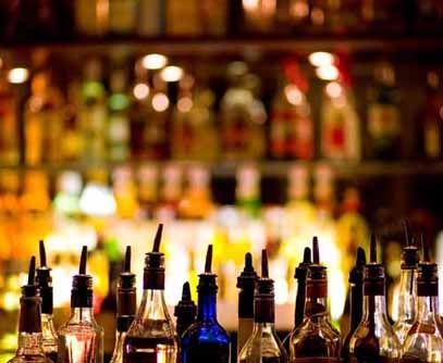 bottles of alcohol are on a bar